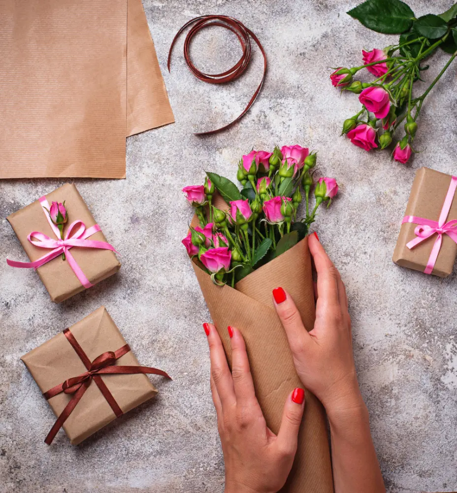 Elegant gift wrapping with ribbon and flowers